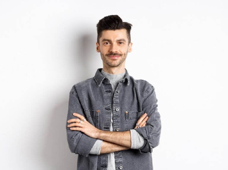 Confident handsome guy in casual outfit cross arms on chest, smiling pleased, standing professional on white background